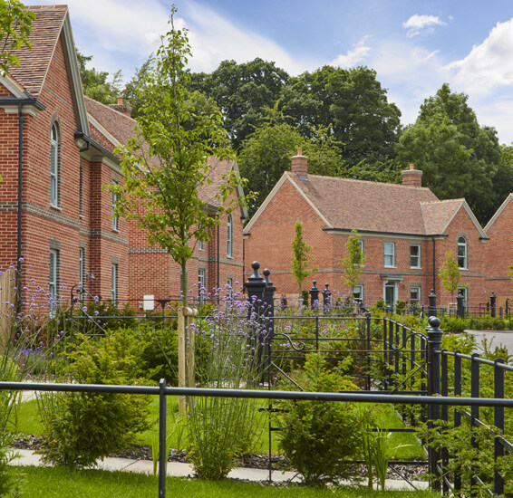Precedent image showing swales integrated within a green corridor offset from houses