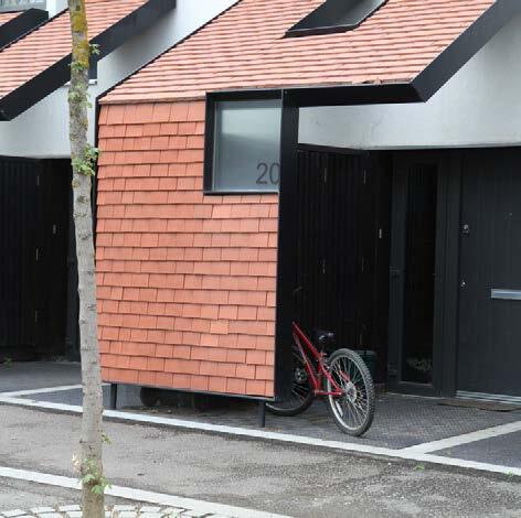 Example of how cycle storage is integrated within the building envelope by have bikes stored in a structure to the front of a dwelling
