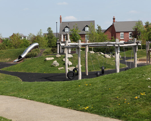 Precedent image showing a suitable example of homes overlooking play spaces